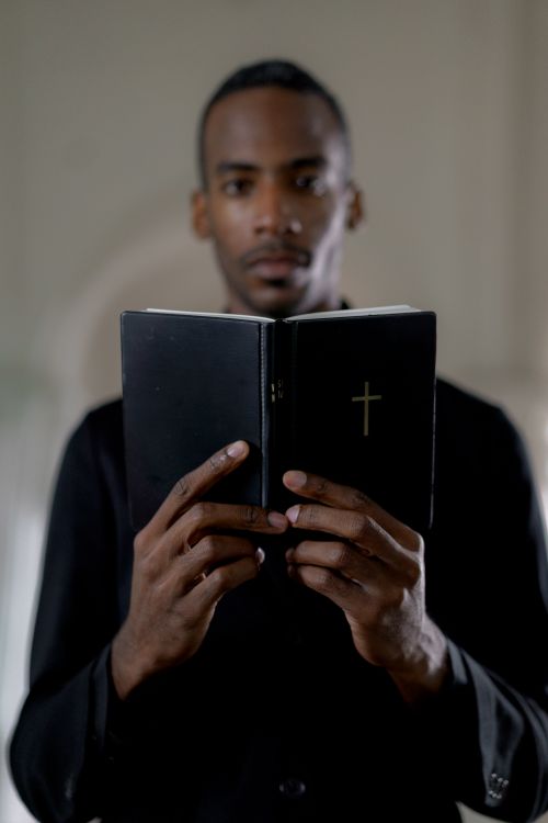 Clergyman holding a Bible
